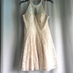 Nude, lace, halter top dress with a sequence top.